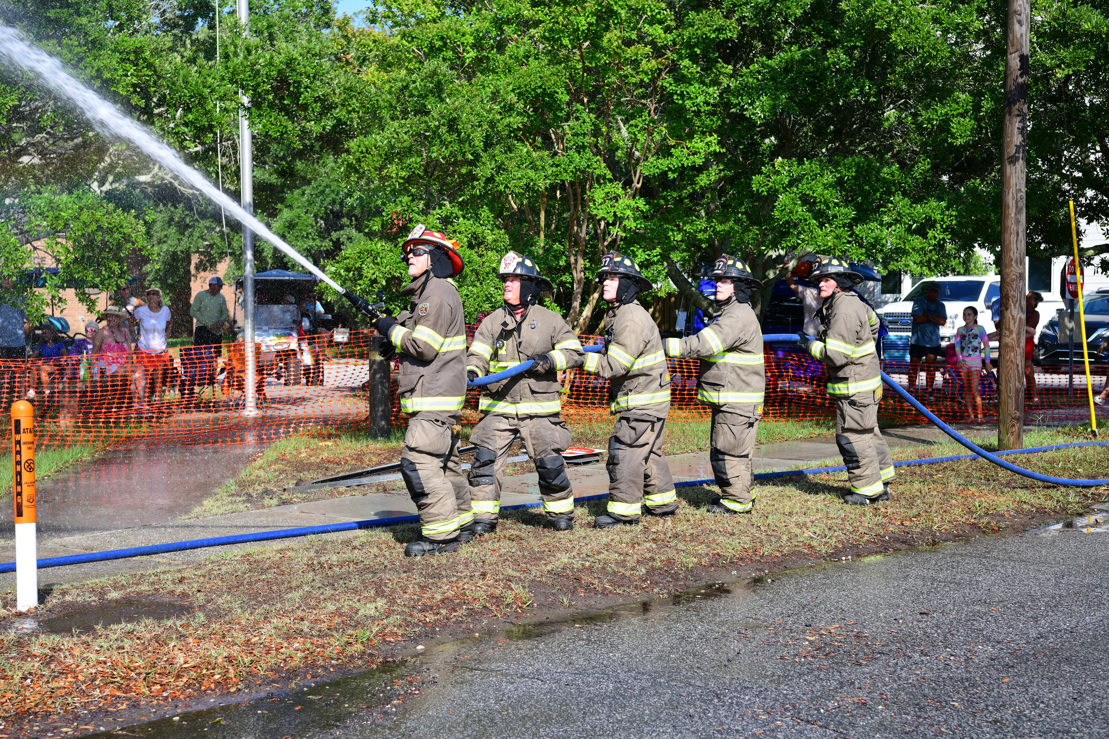 SJFD hose team in action during a water-target event at the Southport competition