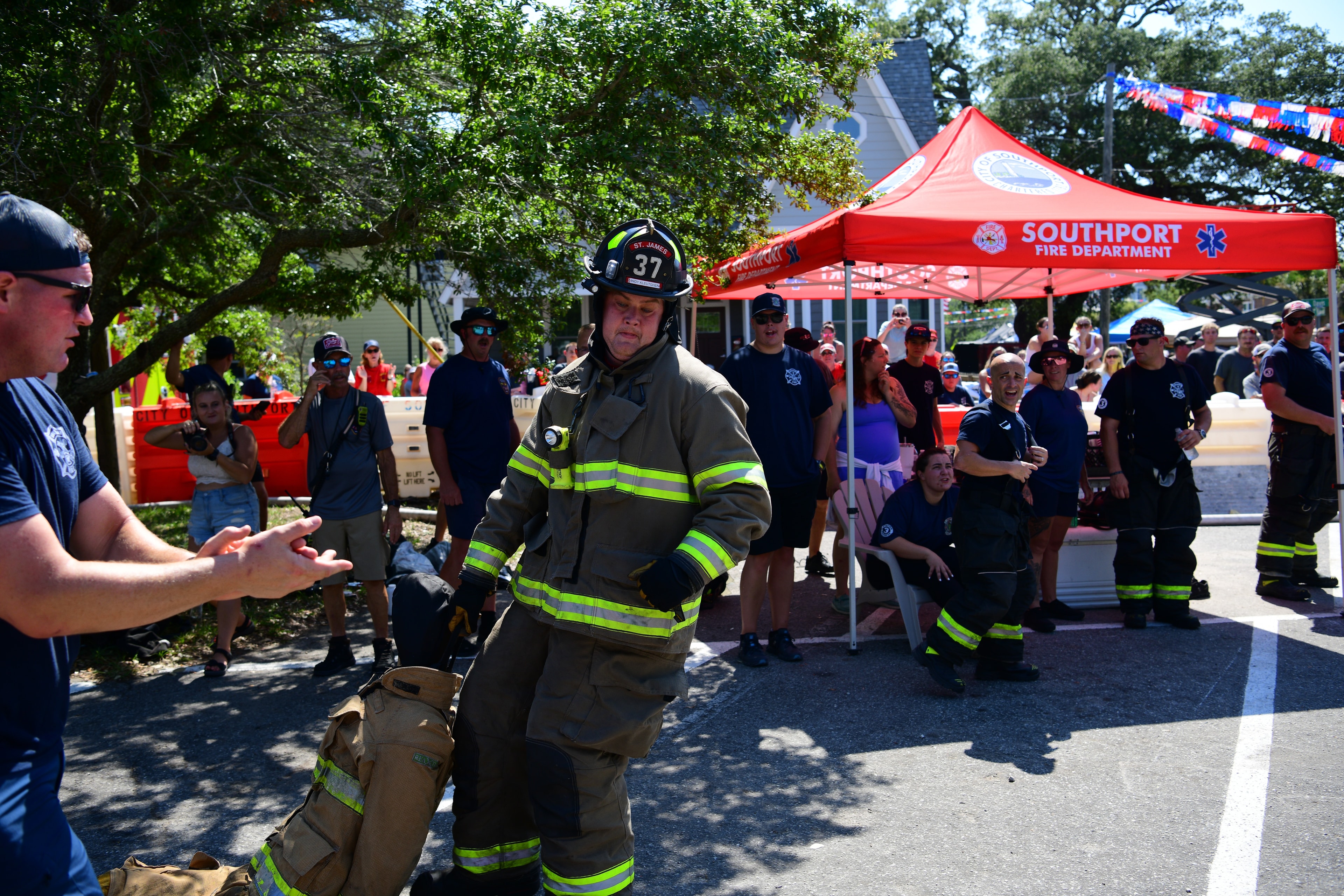 SJFD volunteer at the Southport Fire Department tent during the 2026 Firefighter Freedom Competition