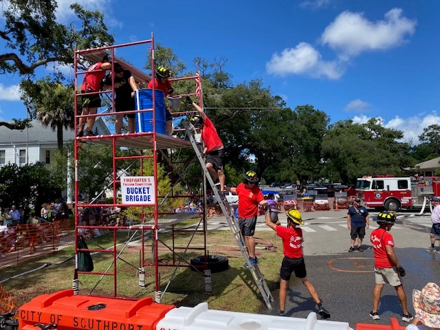 SJFD team members climbing the Bucket Brigade scaffold tower during the Firefighter Freedom Competition