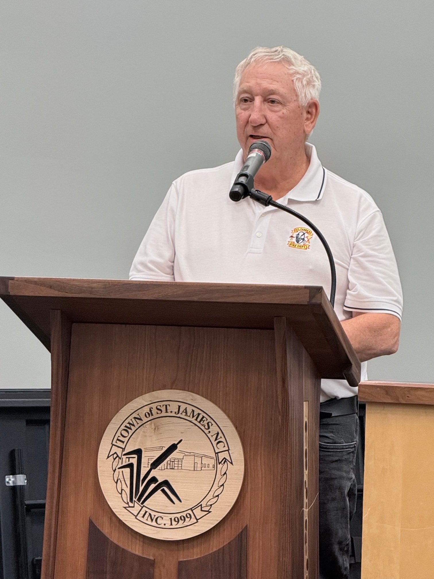Jim Crum at the podium during the August 10 business meeting